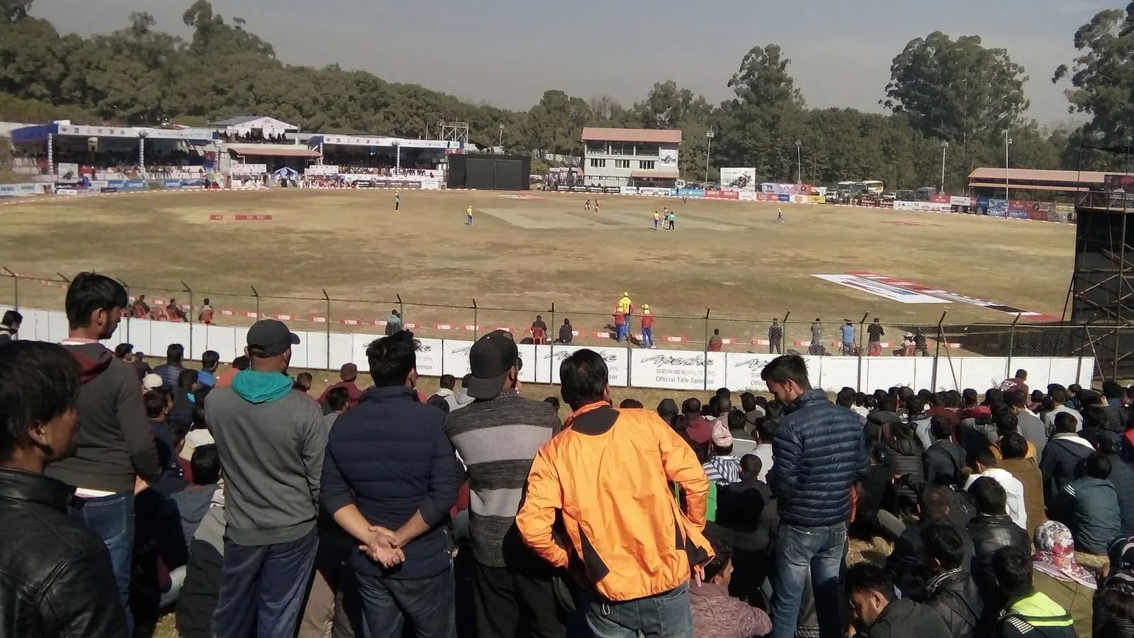 Spectators watching a match at the cricket ground in Kirtipur
